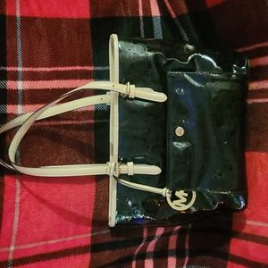 Mk shoulder purse black with cream strap.